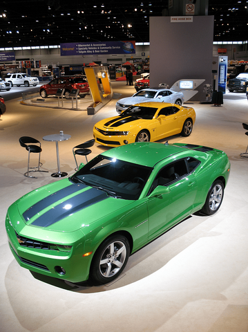 Three Chevrolet Camaro models on display at the 2010 Chicago Auto Show