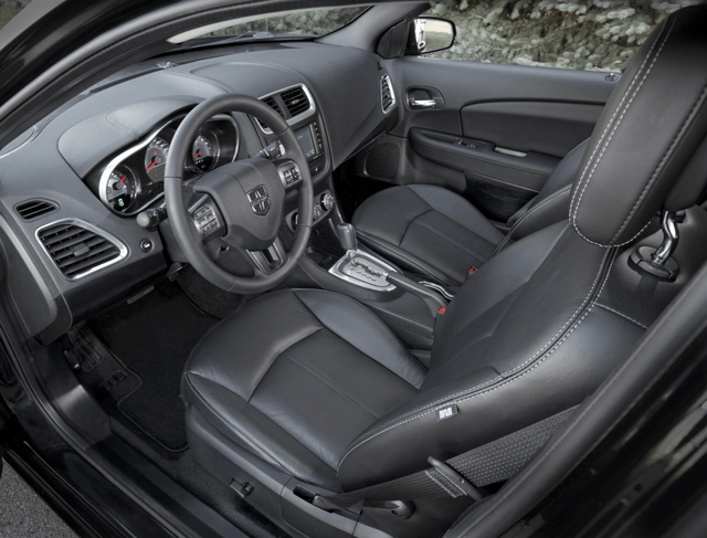 2011 Dodge Avenger interior with black leather seats and center stack