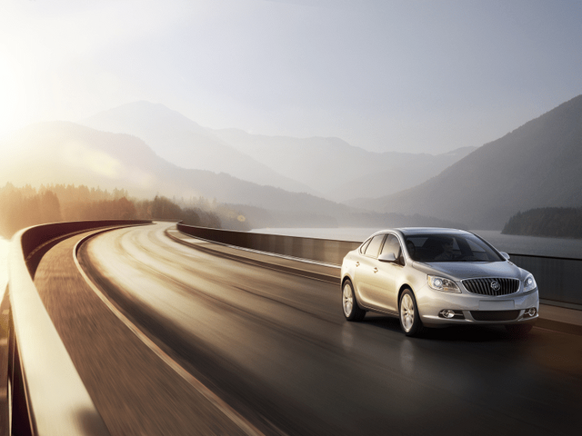 2012 Buick Verano in Motion on Scenic Mountain Road in Silver Ice Metallic
