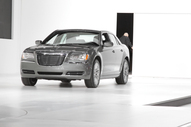 2011 Chrysler 300 gray driving out of reveal stage front angle