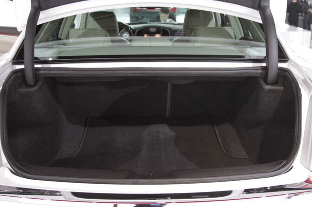 2011 Chrysler 300 open trunk showing carpeted cargo area