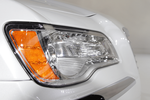 2011 Chrysler 300 headlight detail with amber turn signal close-up