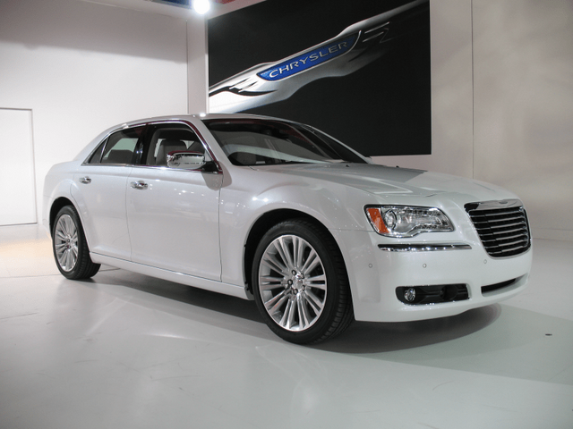 2011 Chrysler 300 white driver-side front three-quarter view