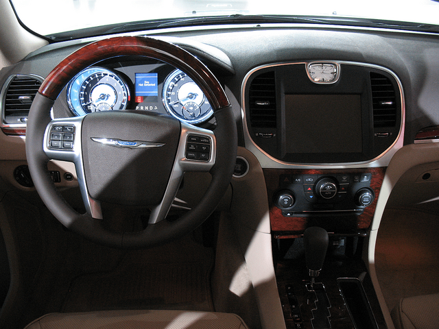 2011 Chrysler 300 interior dashboard with wood trim and touchscreen