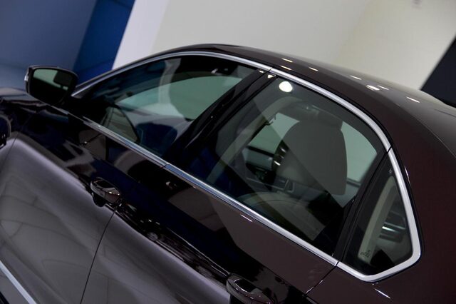 2012 Volkswagen Passat Deep Black Pearl door and window detail