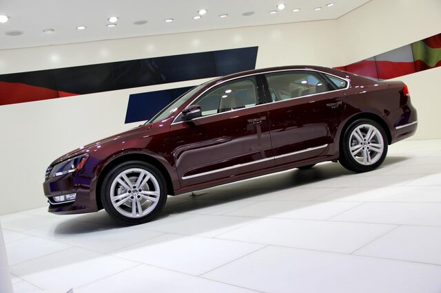 2012 Volkswagen Passat TDI passenger side profile deep red auto show