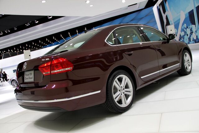 2012 Volkswagen Passat TDI SEL rear three-quarter view deep maroon auto show