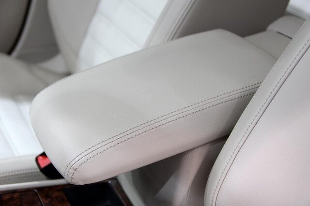 2012 Volkswagen Passat front seat leather upholstery and power seat controls detail