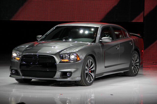 2012 Dodge Charger SRT-8, front three-quarter view under auto show spotlight