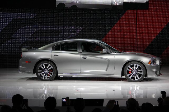 2012 Dodge Charger SRT-8, driver-side profile view on auto show stage