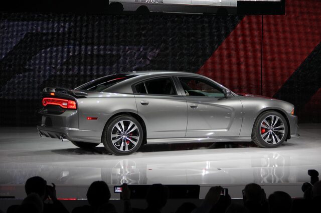 2012 Dodge Charger SRT-8, passenger-side rear three-quarter view on stage