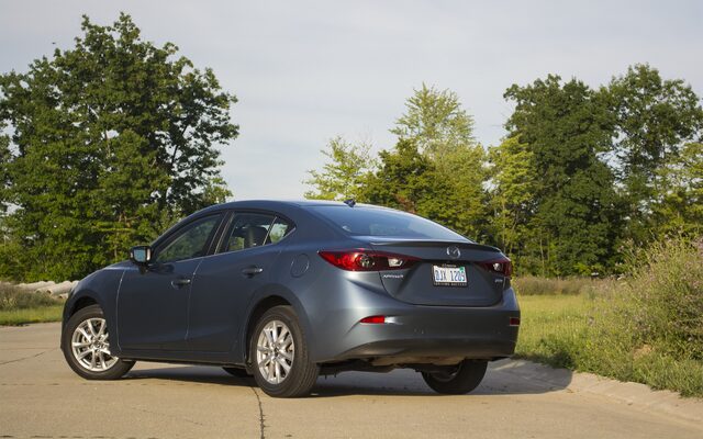 2016 Mazda 3i Grand Touring Sedan - Three-Quarter Rear View in Blue