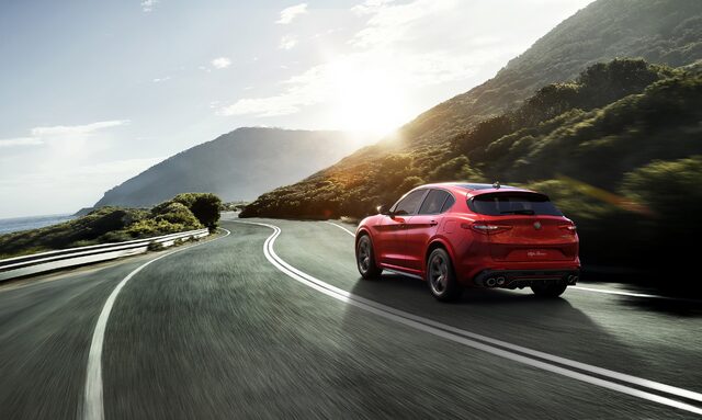 2018 Alfa Romeo Stelvio Ti Rear Three-Quarter View on Coastal Mountain Road