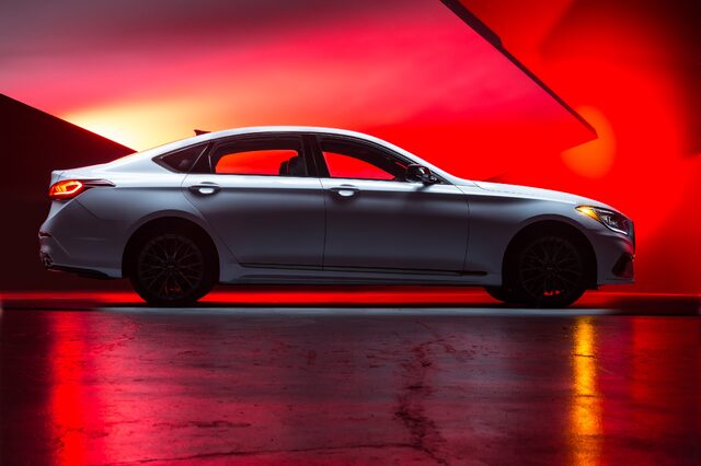 2018 Genesis G80 Sport White Side Profile in Studio with Red Lighting