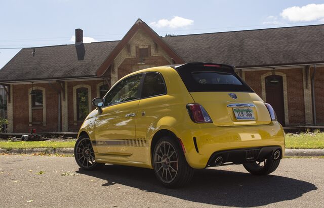 2016 Fiat 500C Abarth Rear Three-Quarter View in Front of Red Brick Building with Top Up