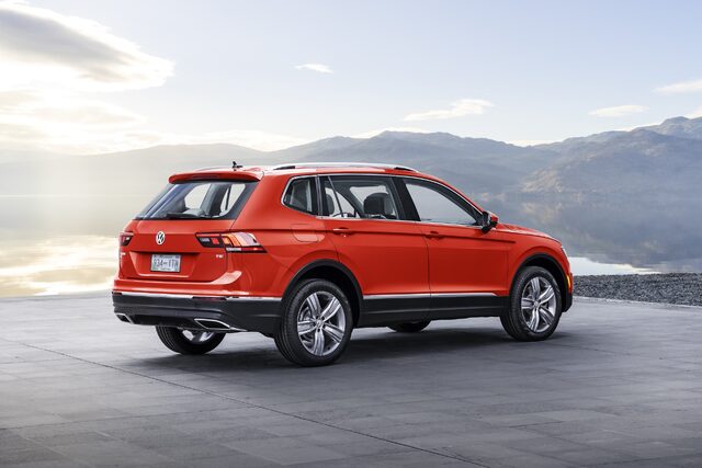 2018 Volkswagen Tiguan SE rear three-quarter view in red by lakeside