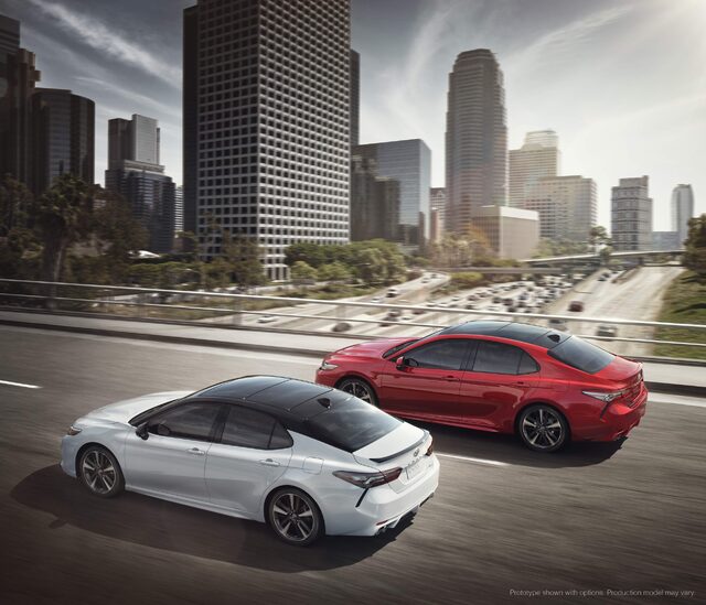 2018 Toyota Camry XSE White and Red Models on Urban Highway