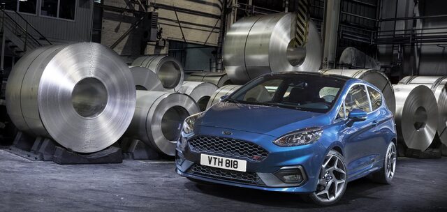 2018 Ford Fiesta ST blue hatchback front three-quarter view in steel coil factory