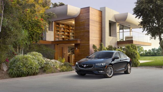 2018 Buick Regal Sportback front three-quarter view at modern home