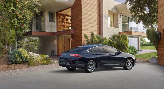2018 Buick Regal Sportback rear three-quarter view at modern home