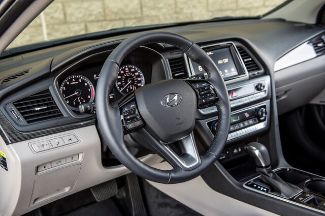 2018 Hyundai Sonata Sport driver cockpit with steering wheel and dual-zone infotainment view
