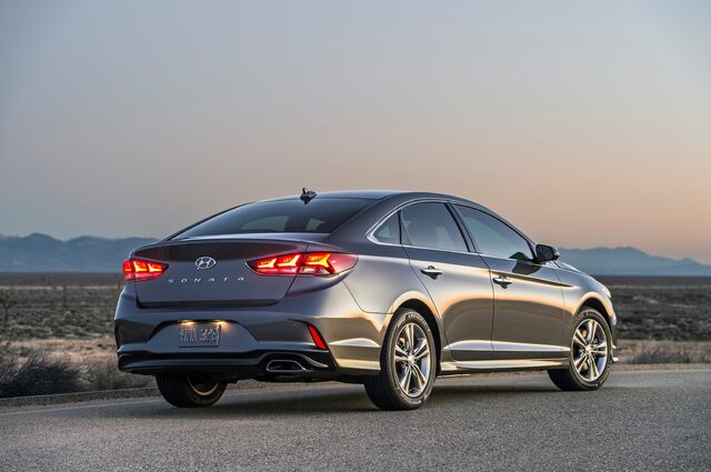 2018 Hyundai Sonata Sport gray sedan rear three-quarter view at dusk in desert