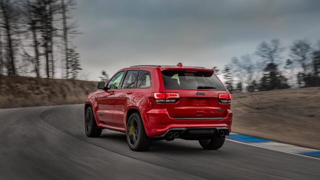 2018 Jeep Grand Cherokee Trackhawk Red Rear Three-Quarter Rolling on Race Track