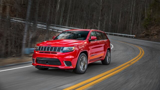 2018 Jeep Grand Cherokee Trackhawk Red Rolling Front Corner View on Winding Road