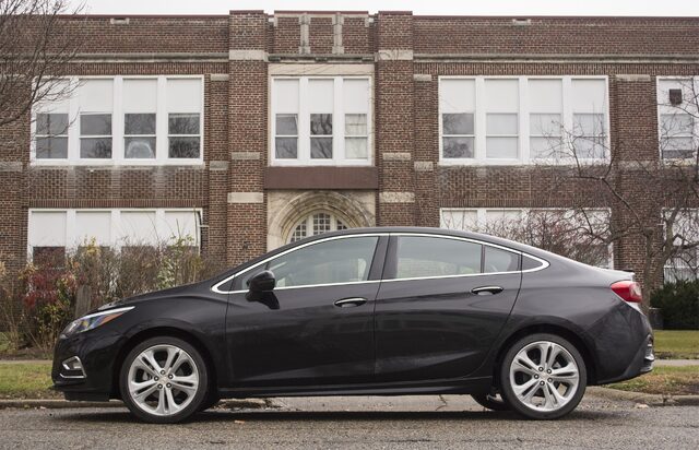 2017 Chevrolet Cruze Premier Driver Side Profile in Front of Brick School Building