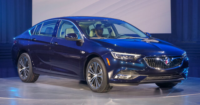 2018 Buick Regal Sportback blue front three-quarter live reveal on stage
