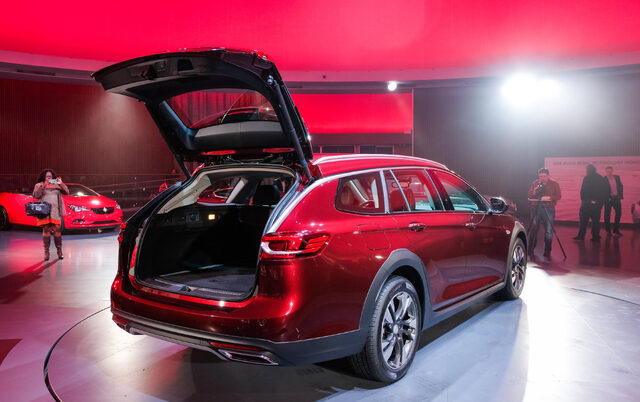 2018 Buick Regal TourX red hatch open on stage at live reveal