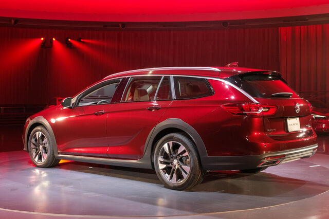 2018 Buick Regal TourX red rear three-quarter on stage at live reveal