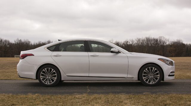 2017 Genesis G80 3.8 HTRAC Driver Side Profile on Open Road with Flat Grass Field