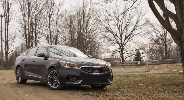 2017 Kia Cadenza Limited Front Three-Quarter View in Bare Winter Trees Setting