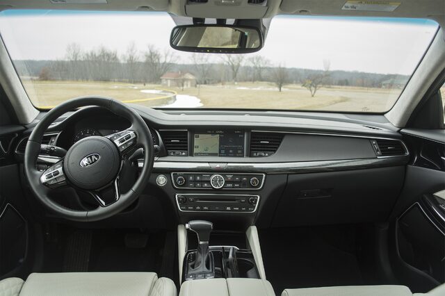 2017 Kia Cadenza Limited Interior Dashboard with Touchscreen Infotainment, Analog Clock, and Light Leather Seats