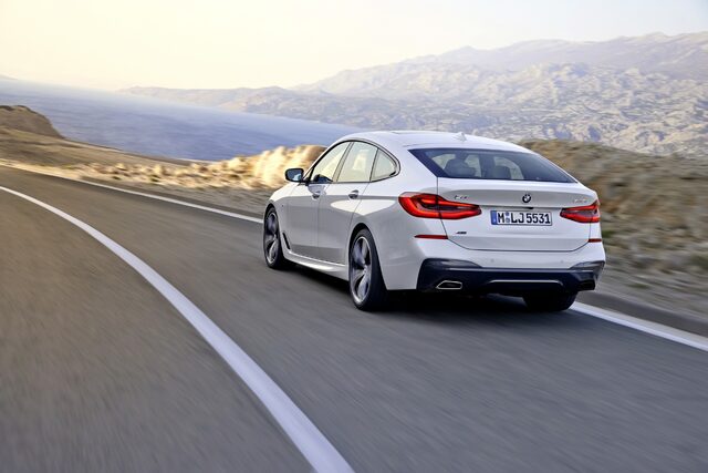 2018 BMW 6-Series GT rear three-quarter action shot on mountain road