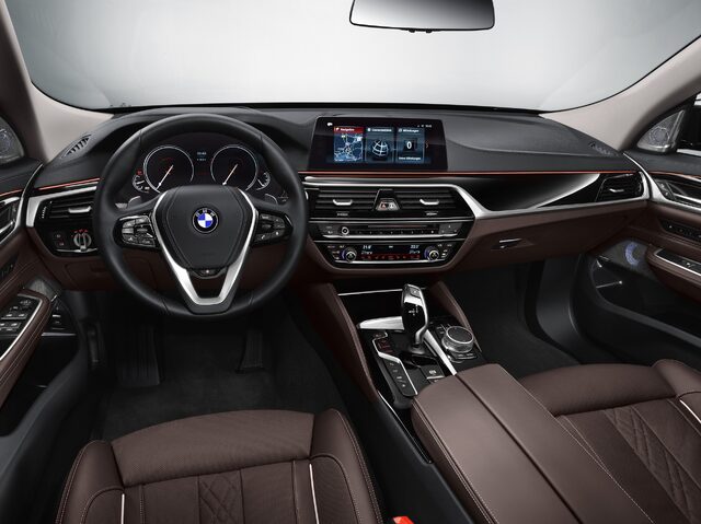 2018 BMW 6-Series GT driver cockpit view with iDrive and leather seating