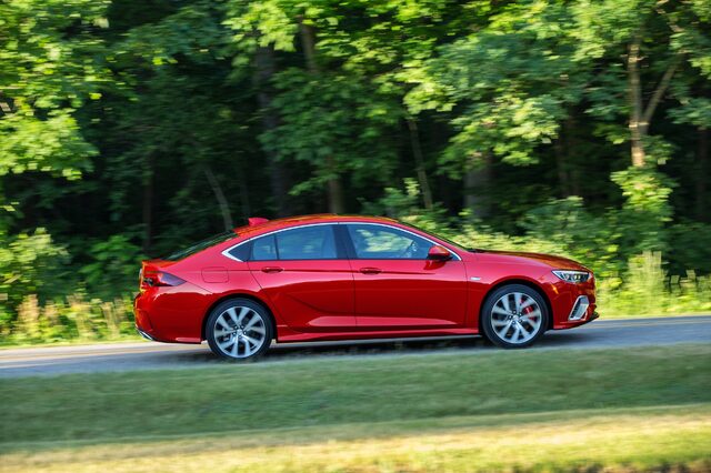 2018 Buick Regal GS, side profile in motion with red brake calipers