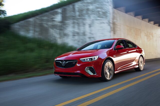 2018 Buick Regal GS, three-quarter front view passing a concrete underpass