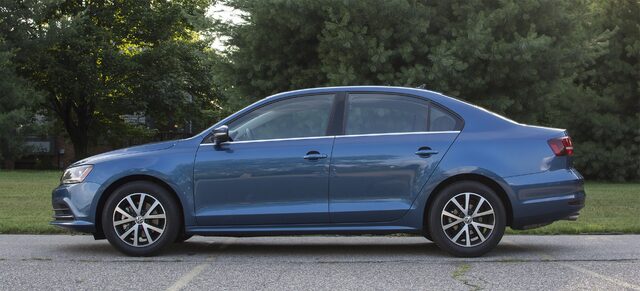 2017 Volkswagen Jetta SE Driver Side Profile on Parking Lot with Summer Trees