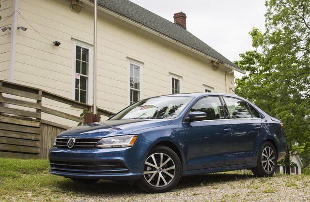 2017 Volkswagen Jetta SE Front Three-Quarter View Parked in Front of White Farmhouse