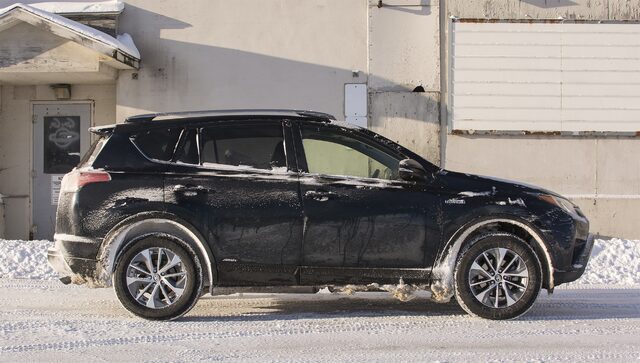 2017 Toyota RAV4 Hybrid XLE Driver Side Profile View in Winter
