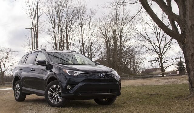 2017 Toyota RAV4 Hybrid XLE Front Three-Quarter View in Winter Rural Setting