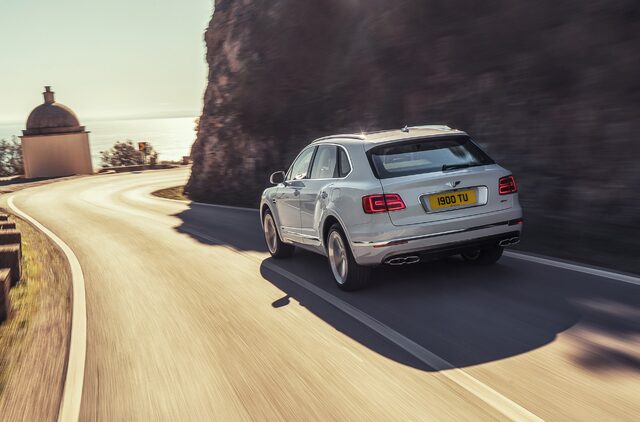 2019 Bentley Bentayga Plug-In Hybrid Rear Three-Quarter Driving Shot