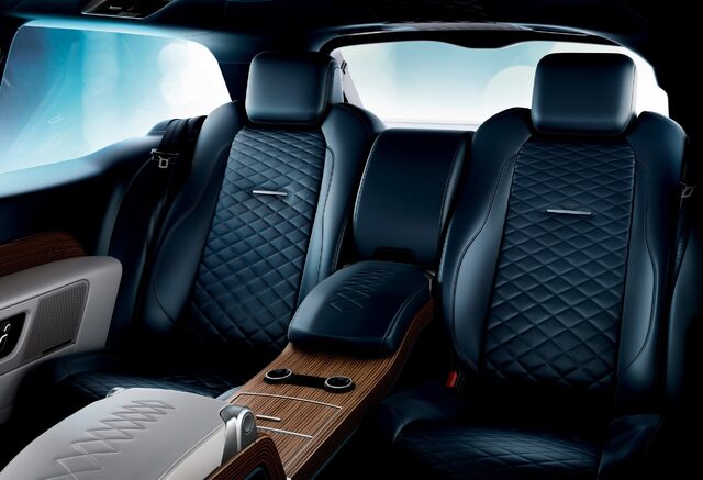 2019 Land Rover Range Rover SV Coupe — Interior, Rear Seat Area With Diamond-Quilted Navy Leather and Wood Console