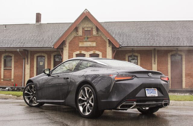2018 Lexus LC 500 rear three-quarter at historic depot in rain