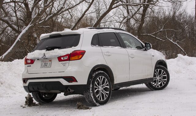 2018 Mitsubishi Outlander Sport SEL rear three-quarter view in snow