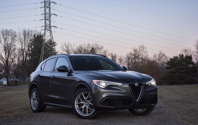2018 Alfa Romeo Stelvio Ti three-quarter front view at dusk