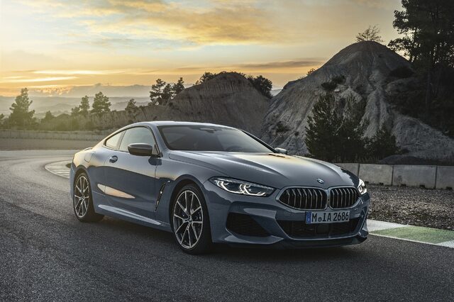 2019 BMW M850i xDrive front three-quarter view at sunset