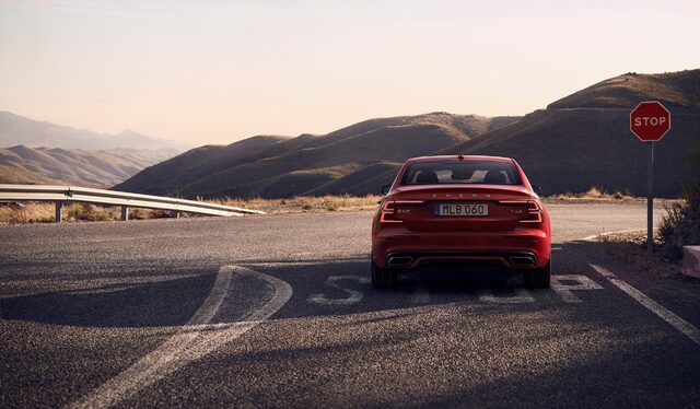 2019 Volvo S60 R-Design rear view on a mountain road